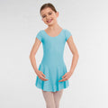 Young girl wearing a light blue dress against a white background