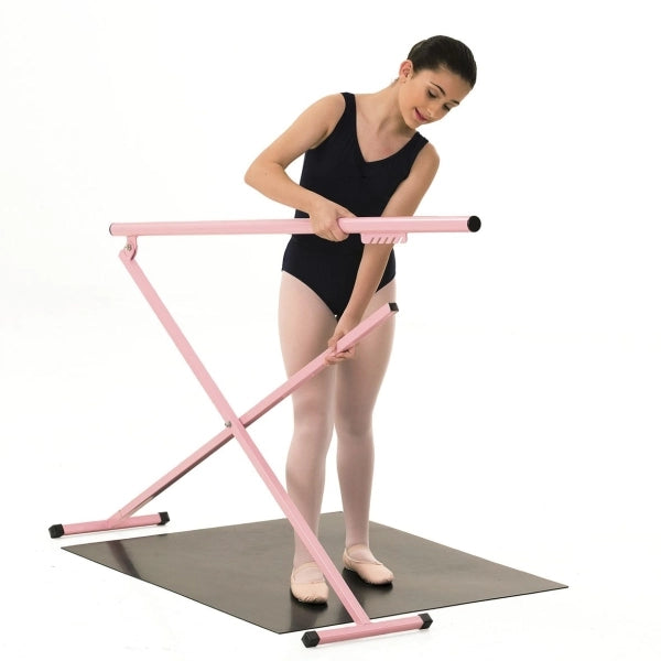 Ballerina using a pink ballet barre on a white background