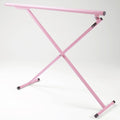 Pink metal X-shaped frame on a white background
