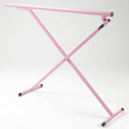 Pink metal X-shaped frame on a white background