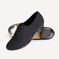 Black canvas shoes with a white background