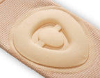 Beige fabric with a circular cutout and central button on a white background