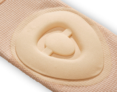 Beige fabric with a circular cutout and central button on a white background