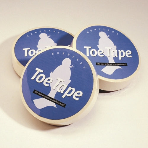 Three rolls of Bunheads Toe Tape on a light beige background