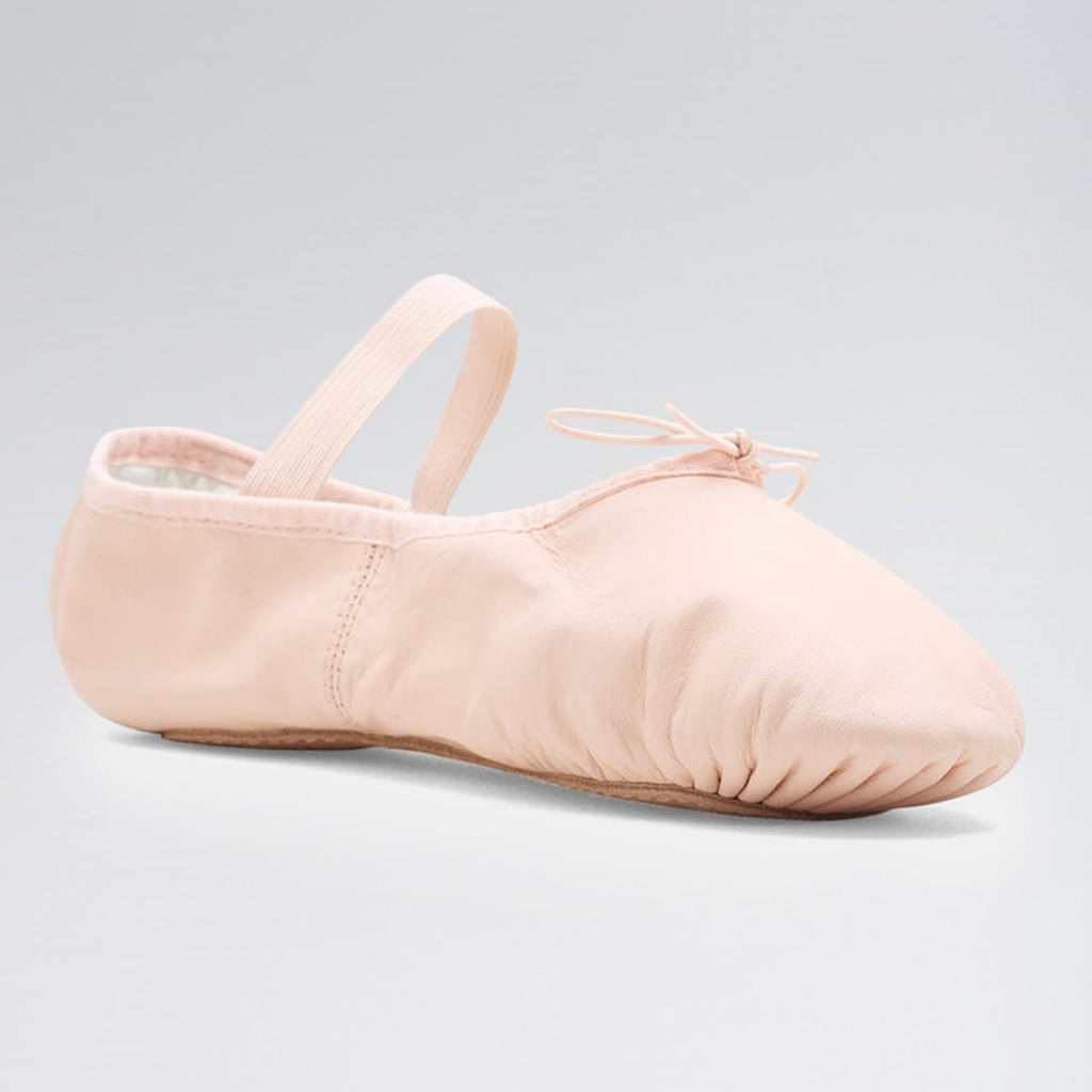 Pink ballet shoe on a light gray background