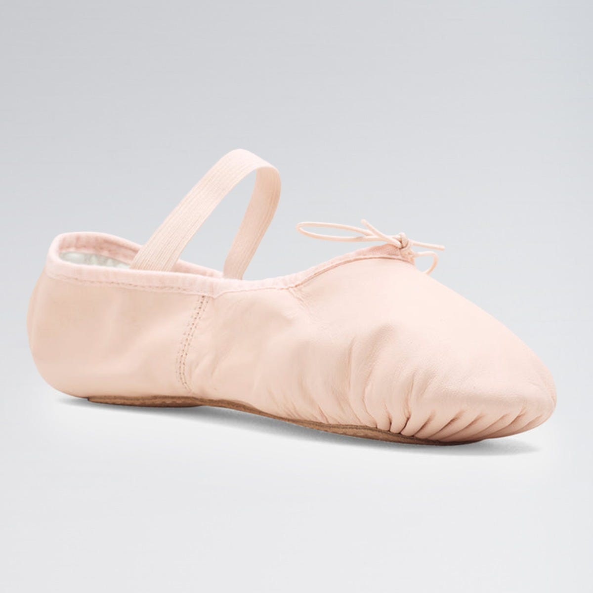 Pink ballet shoe on a light gray background