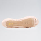 Ballet shoe with beige insole on a gray background