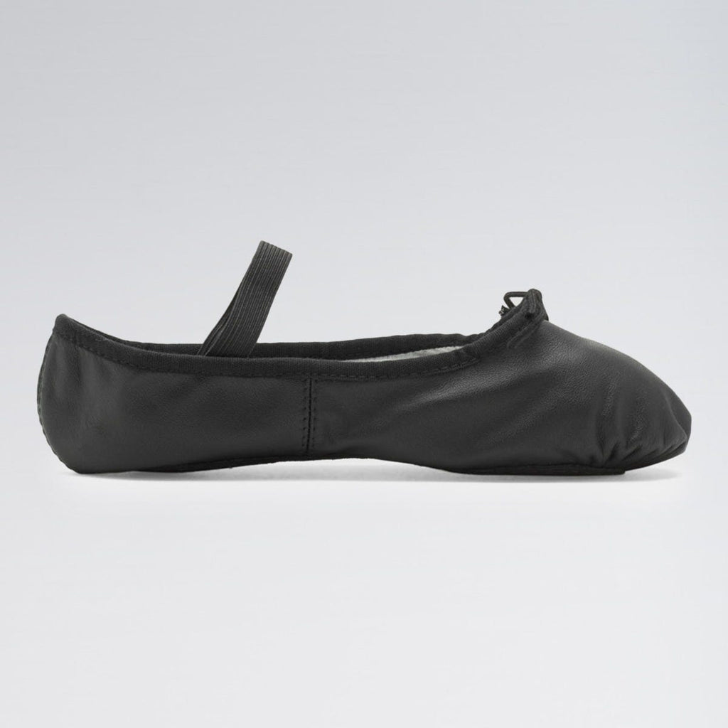 Black ballet shoe on a light gray background
