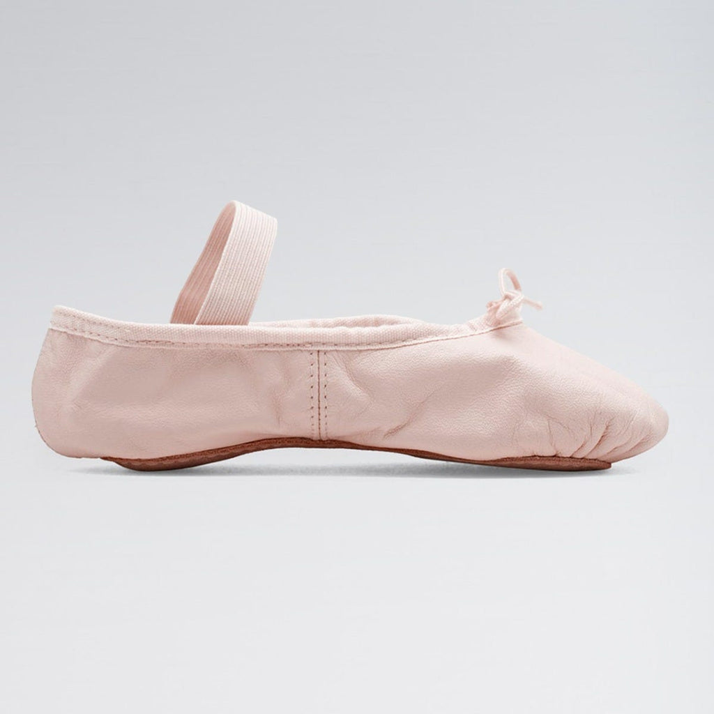 Pink ballet shoe on a light gray background