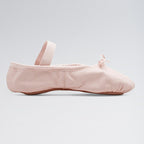 Pink ballet shoe on a light gray background