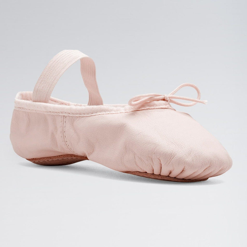 Pink ballet shoe on a light gray background