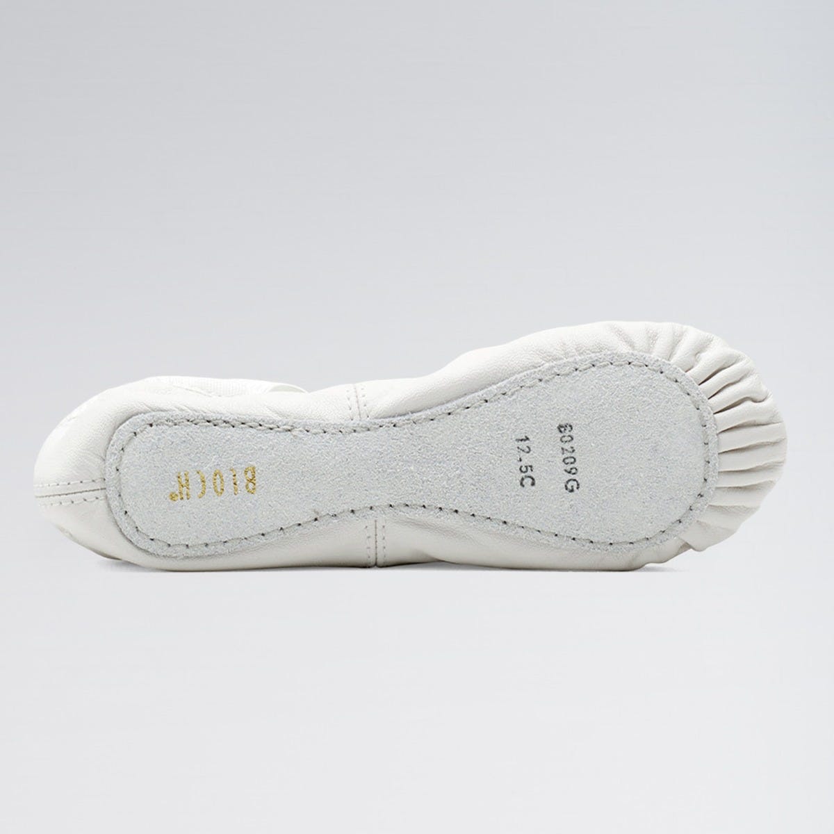 White ballet shoe sole with brand name on a light gray background