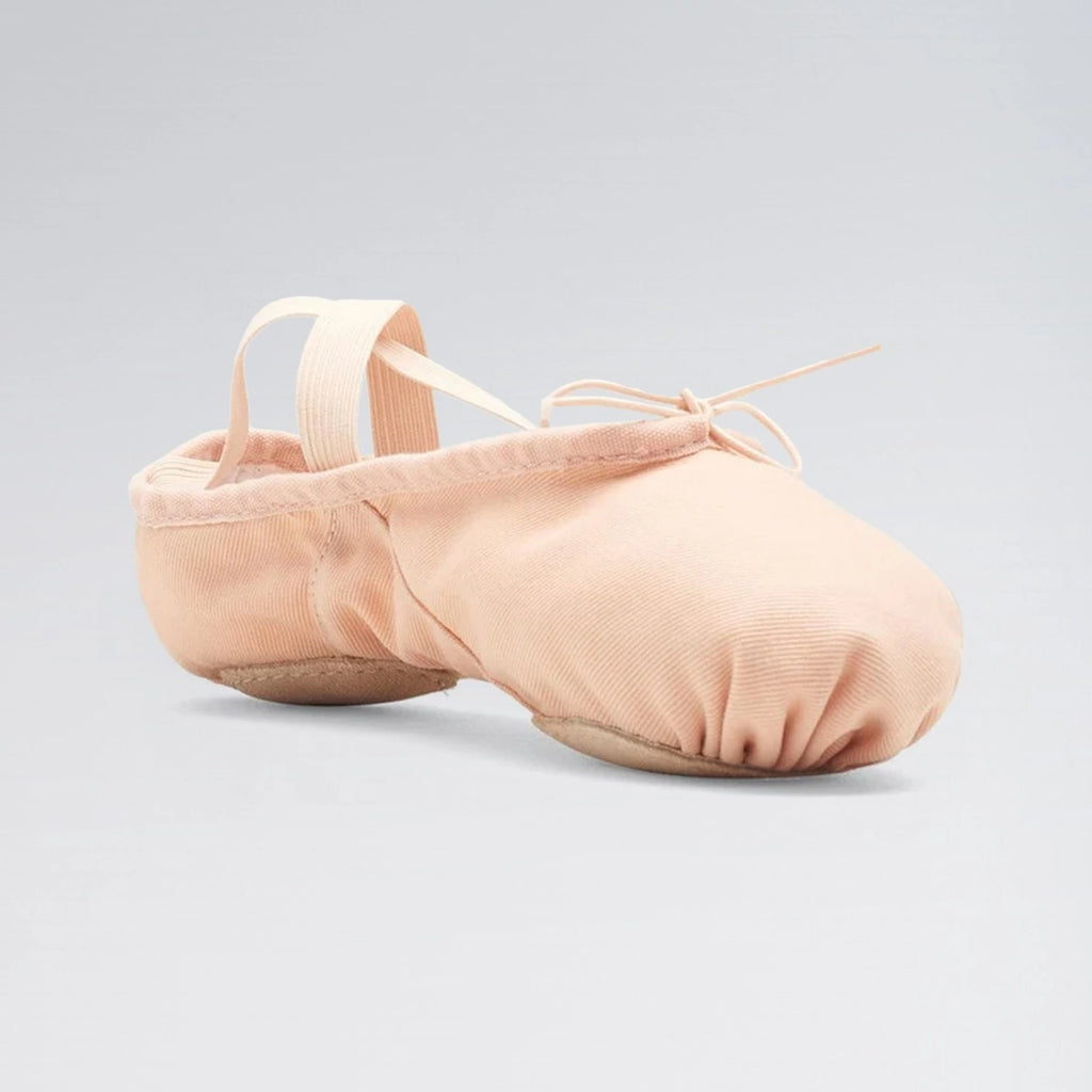 Pair of pink ballet shoes on a light gray background
