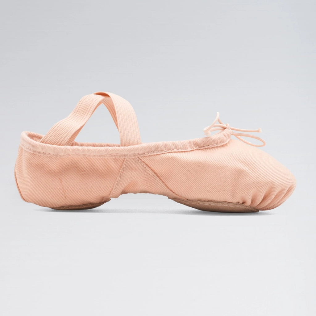 Pink ballet shoe on a light gray background