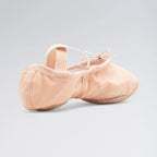 Pair of pink ballet shoes on a light gray background