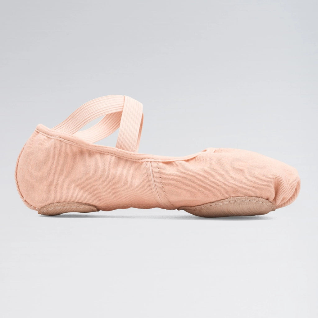 Pink ballet shoe on a gray background