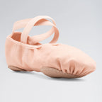 Pink ballet shoe with a strap on a light gray background