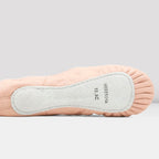 Close-up of a ballet shoe with a light gray sole on a white background