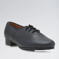 Black tap shoe on a gray background