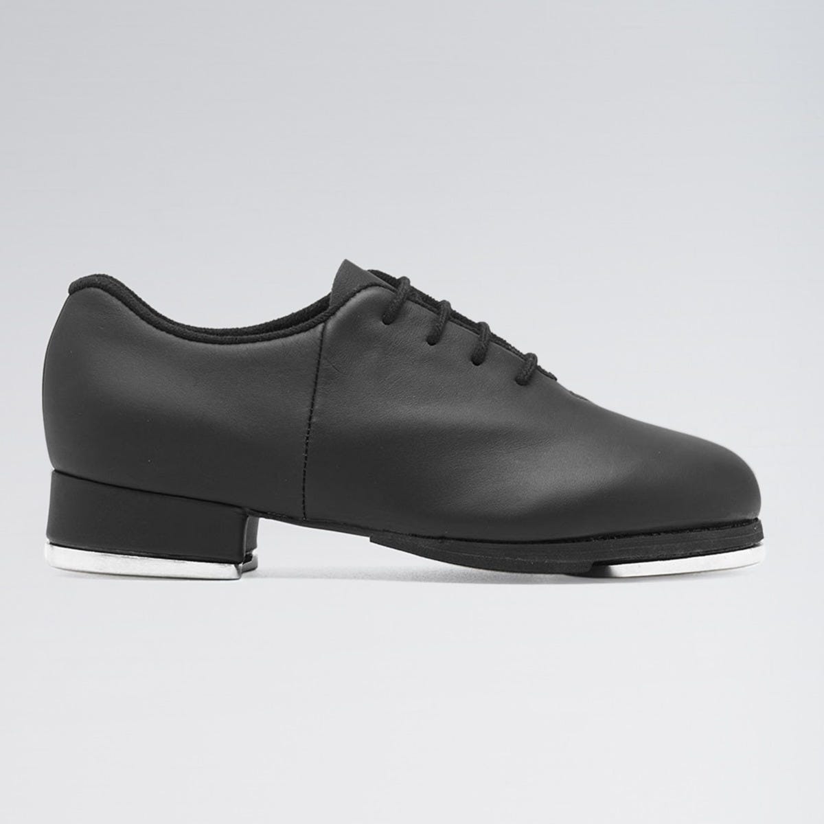 Black tap shoe on a gray background