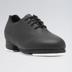Black tap shoe on a gray background