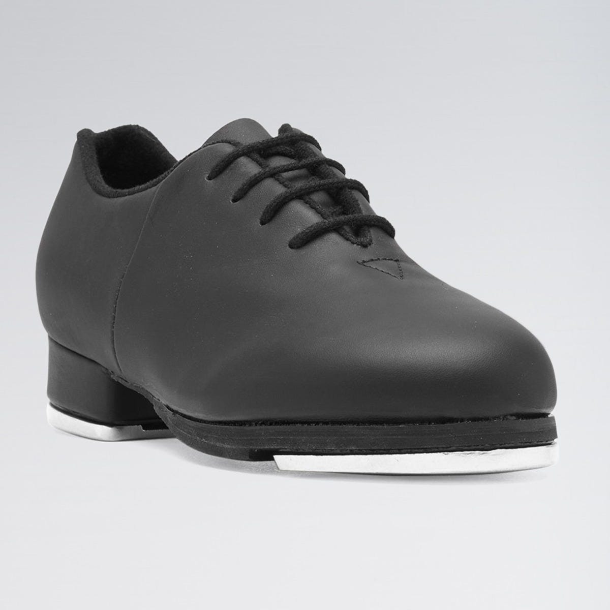 Black tap shoe on a gray background