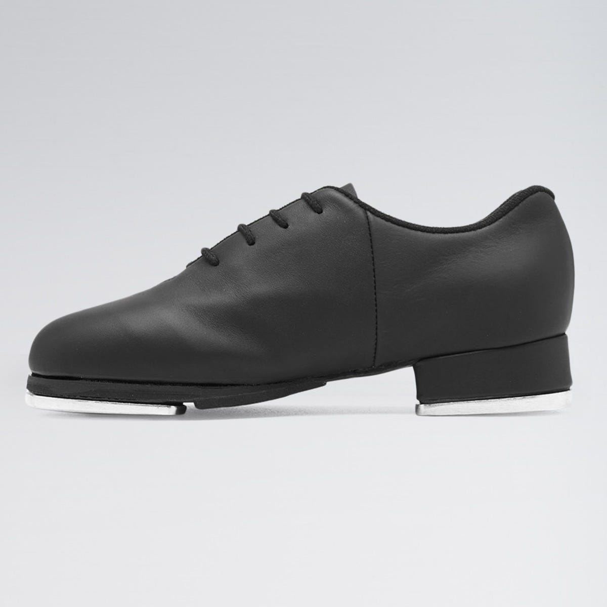 Black tap shoe on a light gray background