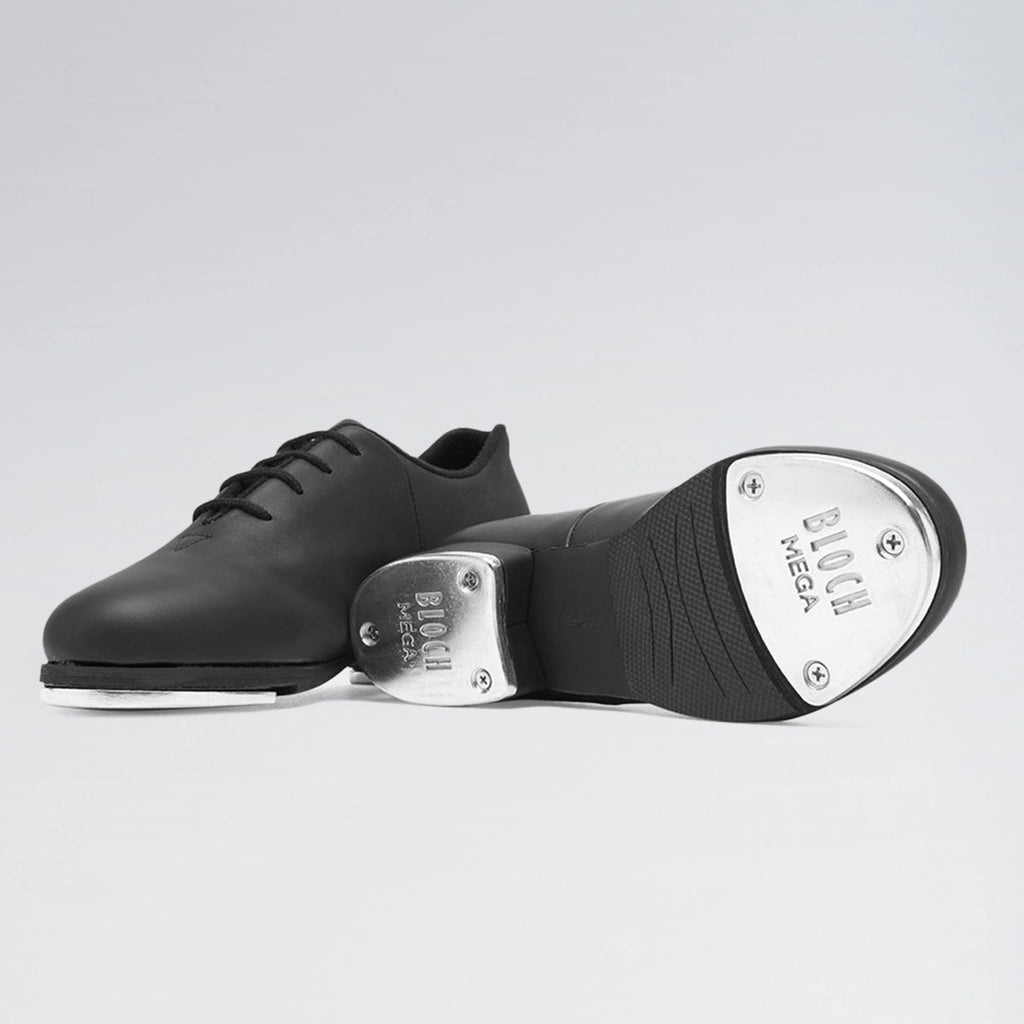 Black tap dance shoe with metallic toe on a light gray background