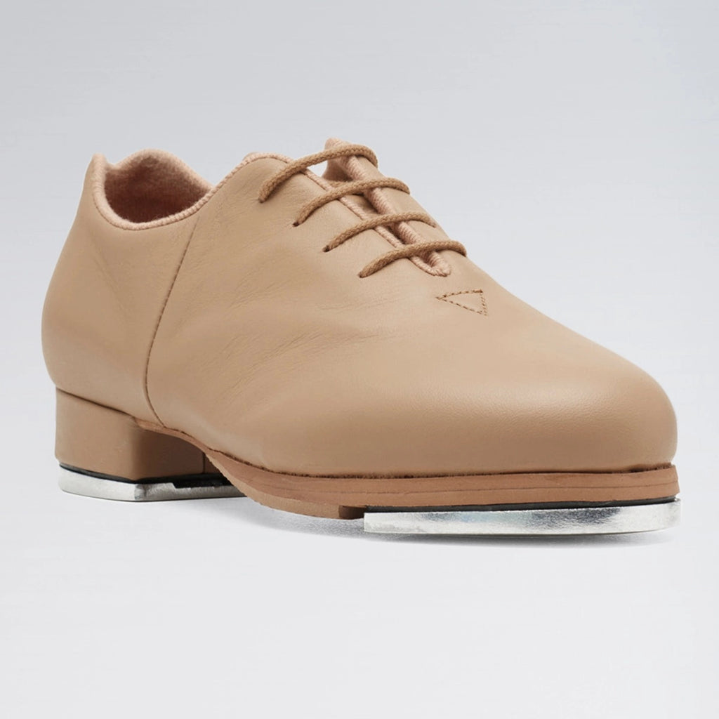 Tan tap shoe with a white background