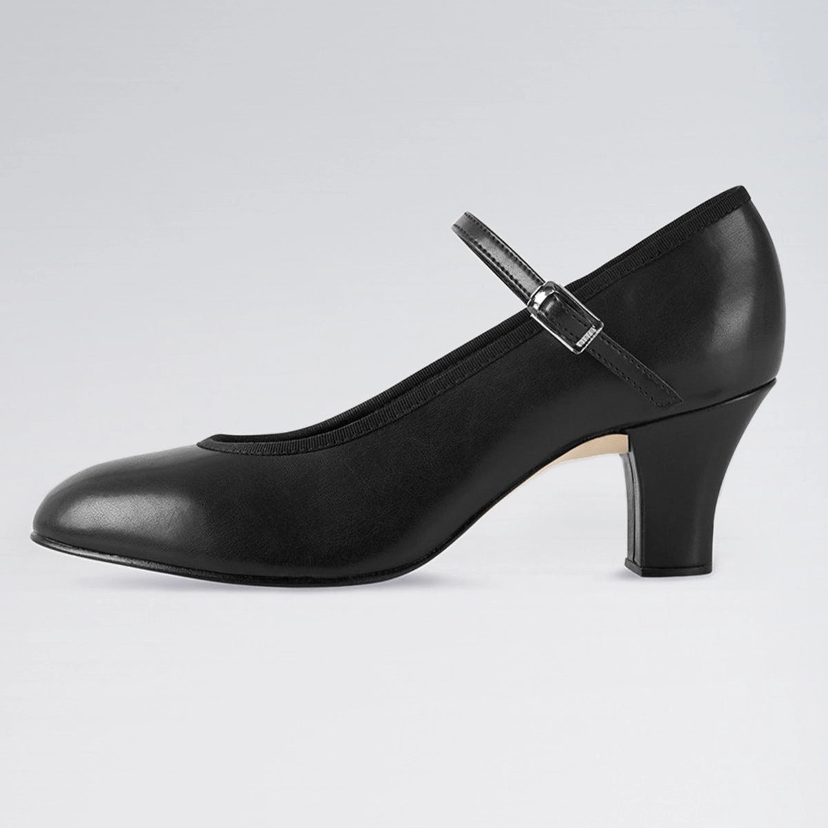 Black leather shoe with a heel on a light gray background
