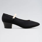 Black shoe with a small white object attached on a gray background