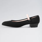 Black shoe with a strap on a light gray background