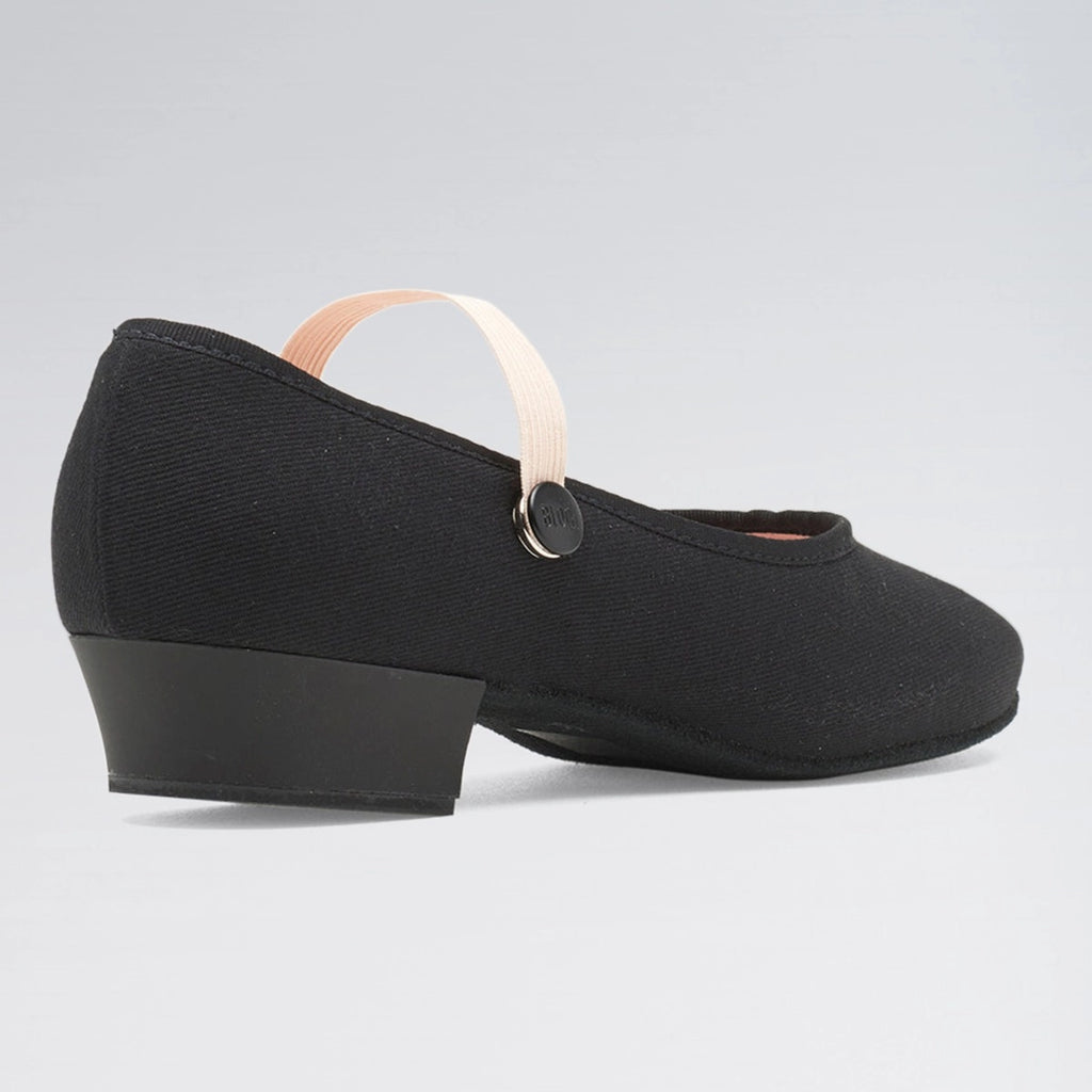 Black shoe with a thick sole on a light gray background