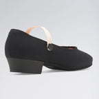 Black shoe with a thick sole on a light gray background