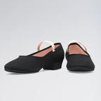 Pair of black dance shoes with a small heel on a light gray background
