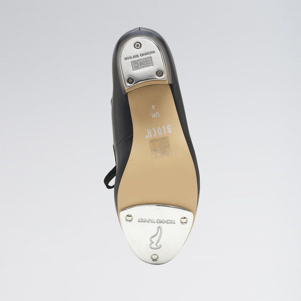 Ballet shoe with a focus on the sole and brand logo on a light gray background