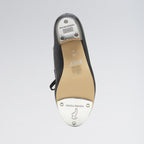 Ballet shoe with a focus on the sole and brand logo on a light gray background