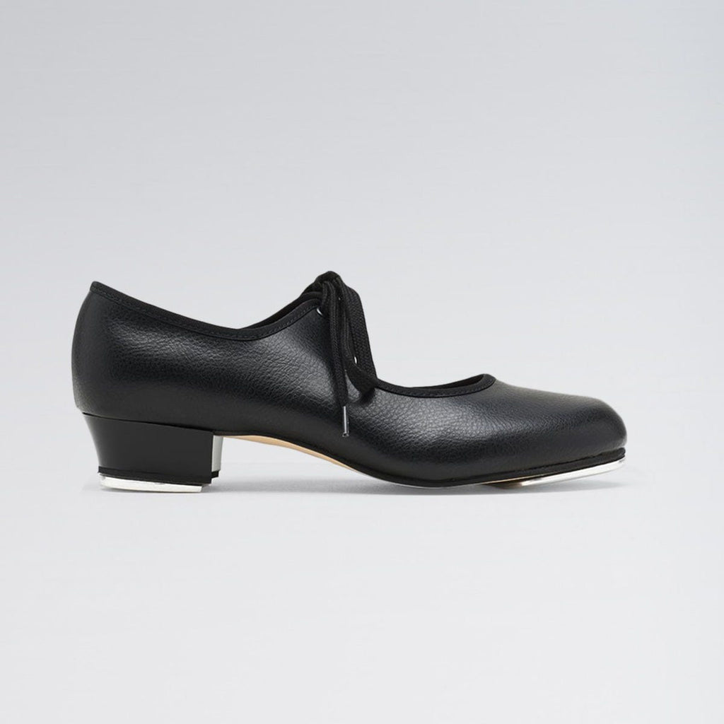 Black shoe with a low heel on a light gray background