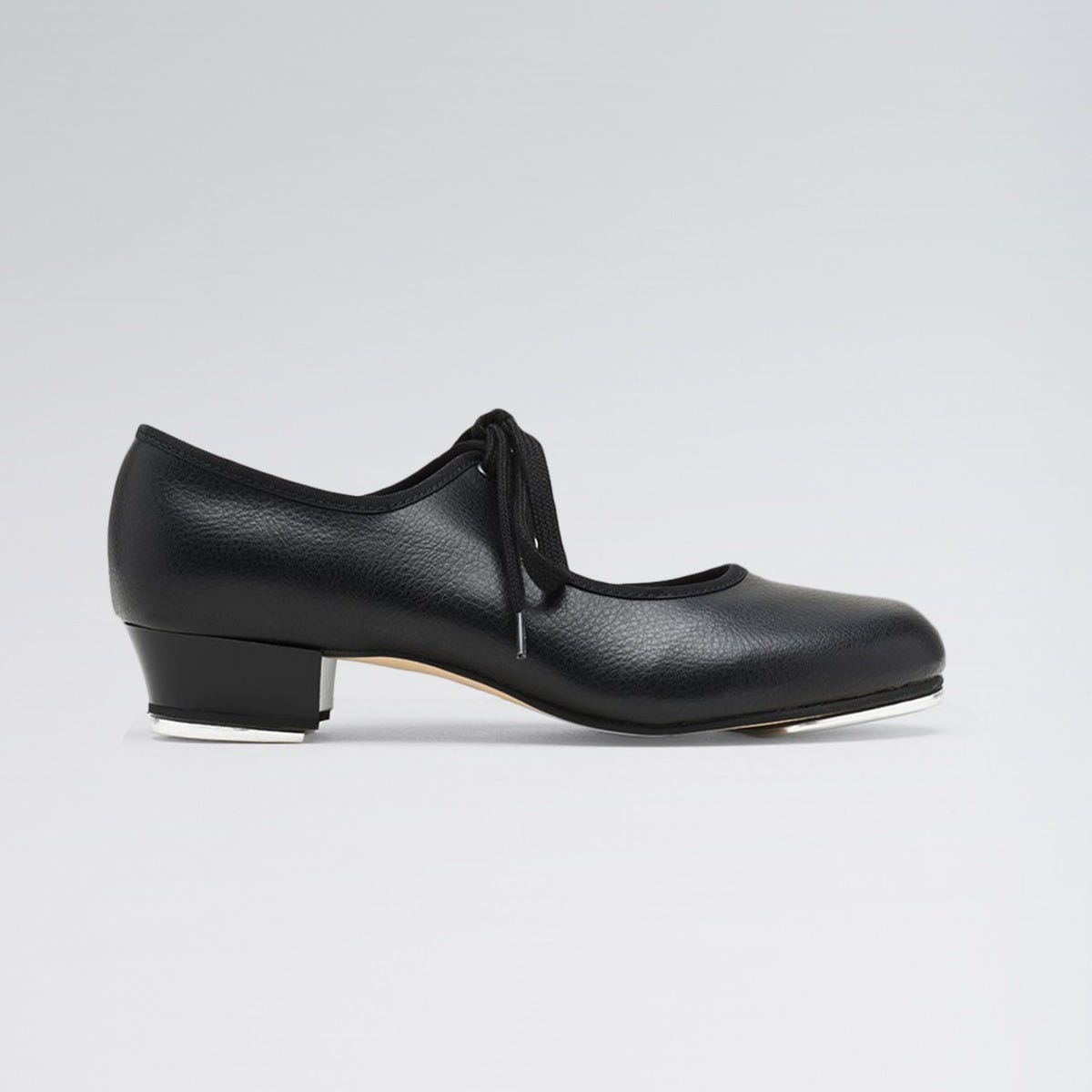 Black shoe with a low heel on a light gray background