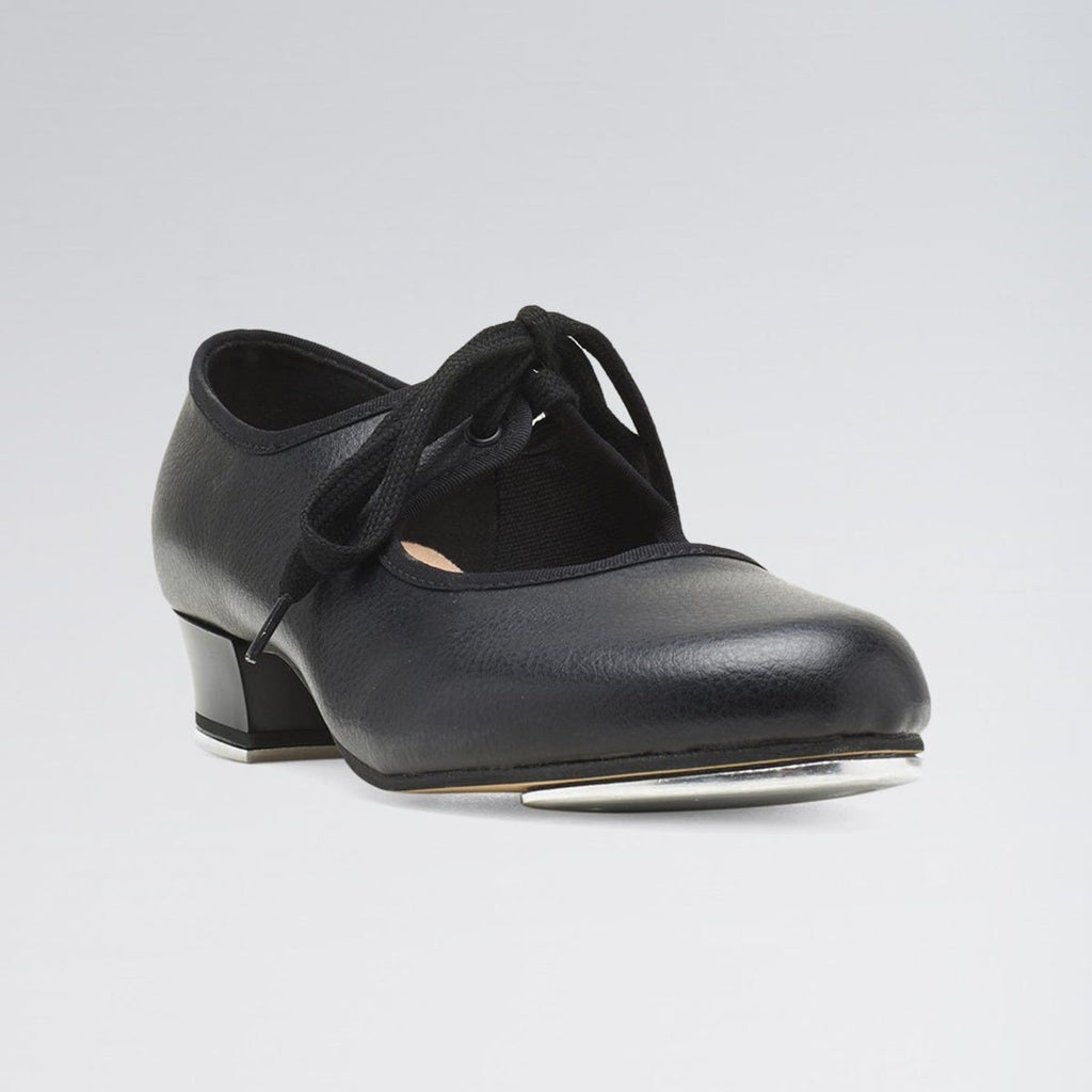 Black tap dance shoe with a small heel and metal tap on a light gray background