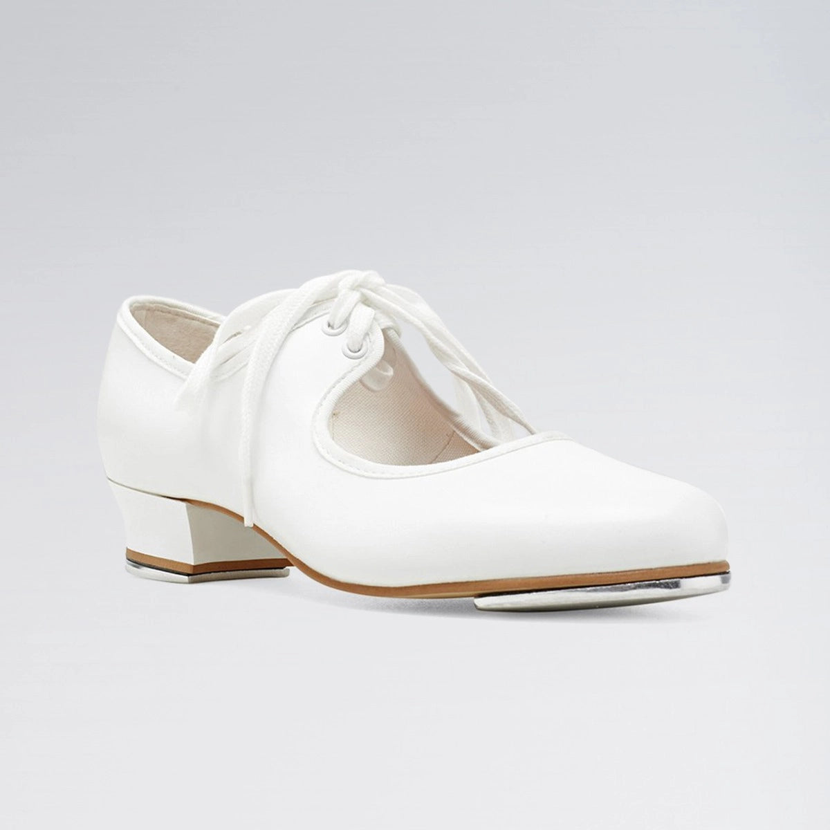 White Oxford shoe with a brown sole on a light gray background
