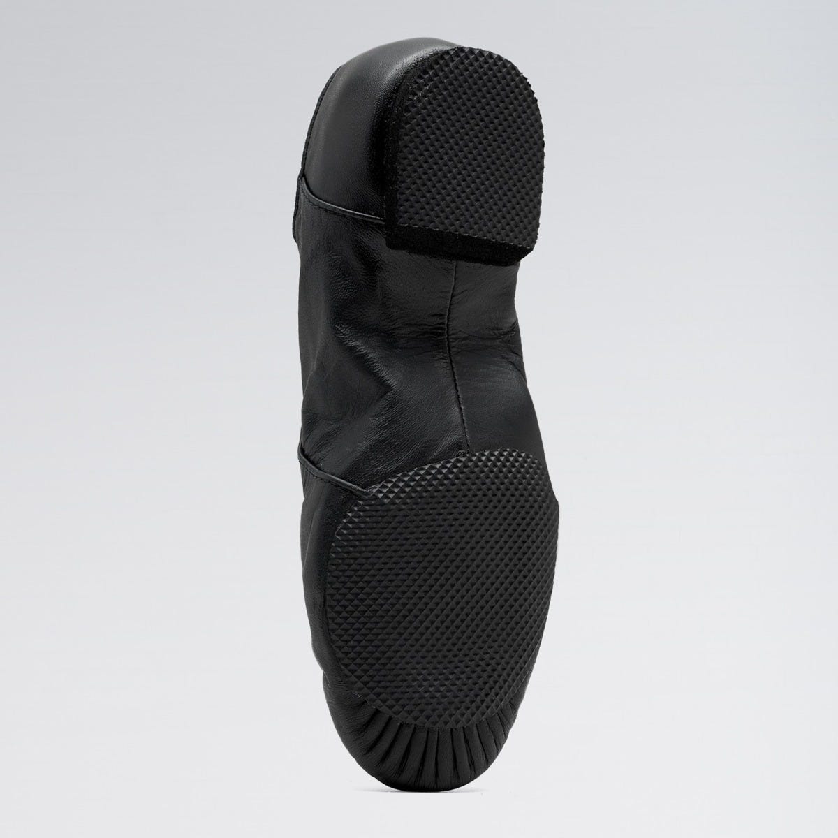 Black rain boot with a textured sole on a light gray background