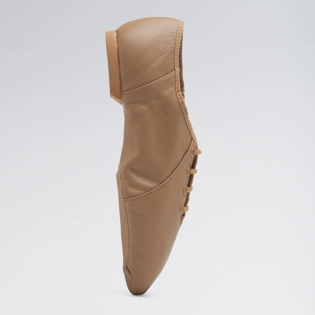Brown leather shoe on a light gray background