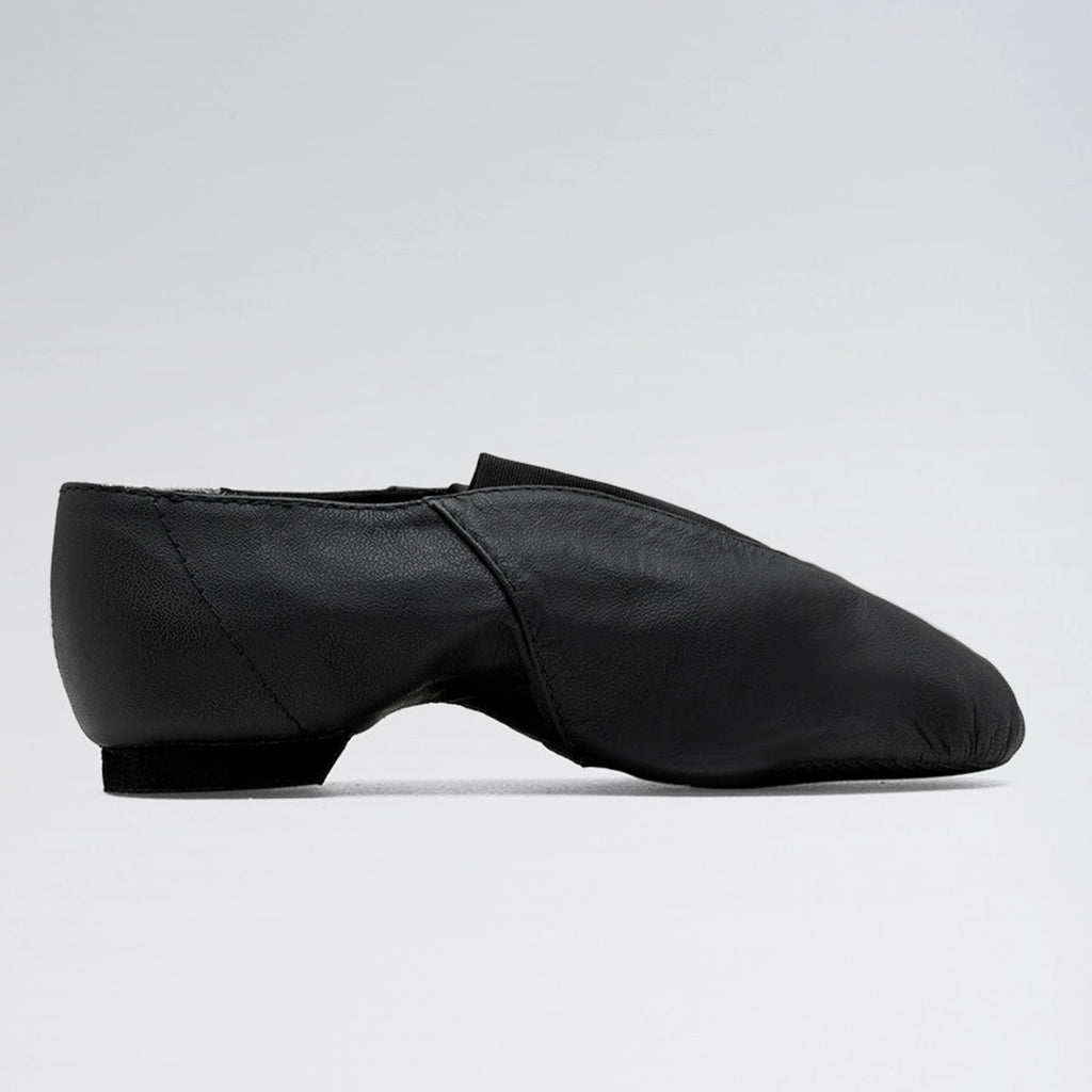Black dance shoe on a light gray background