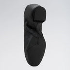 Black dance shoe on a light gray background