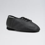 Black leather tap shoe on a light gray background