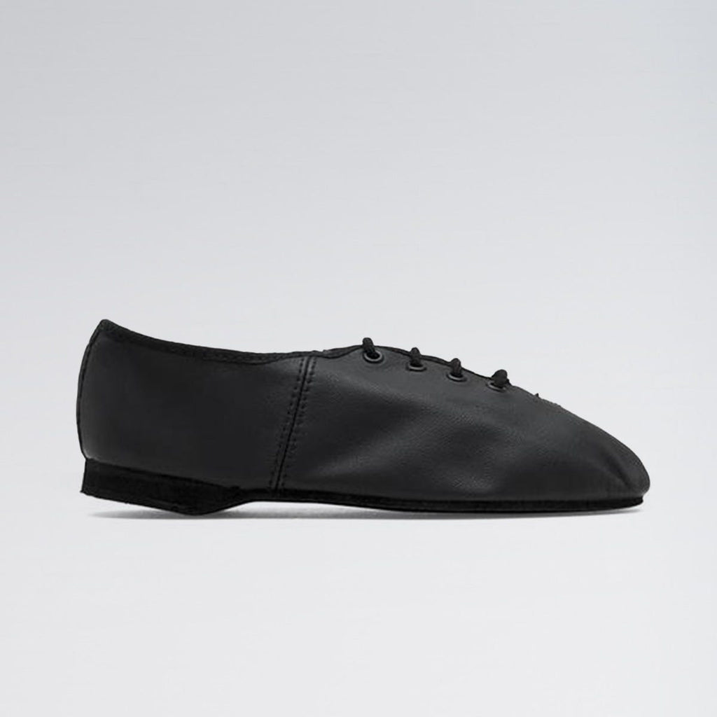 Black leather shoe on a light gray background