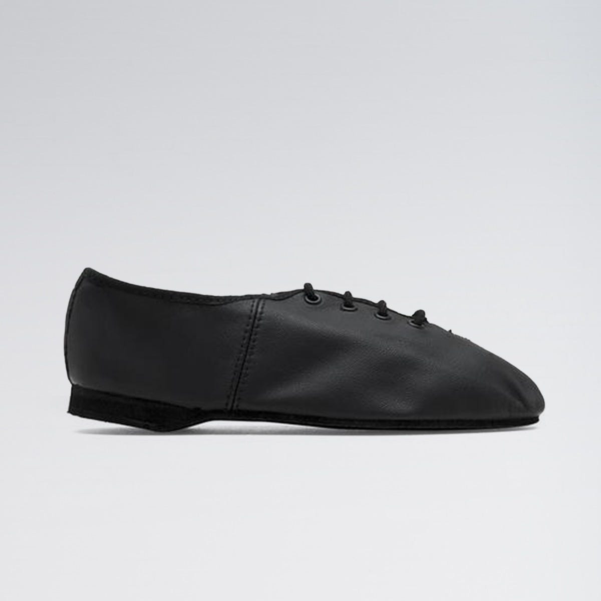 Black leather shoe on a light gray background