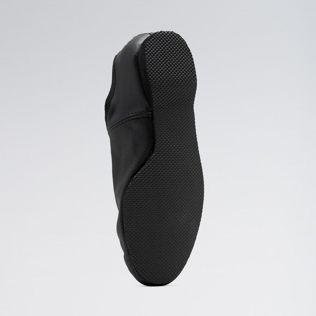 Black shoe sole on a light gray background
