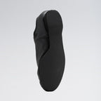 Black shoe sole on a light gray background